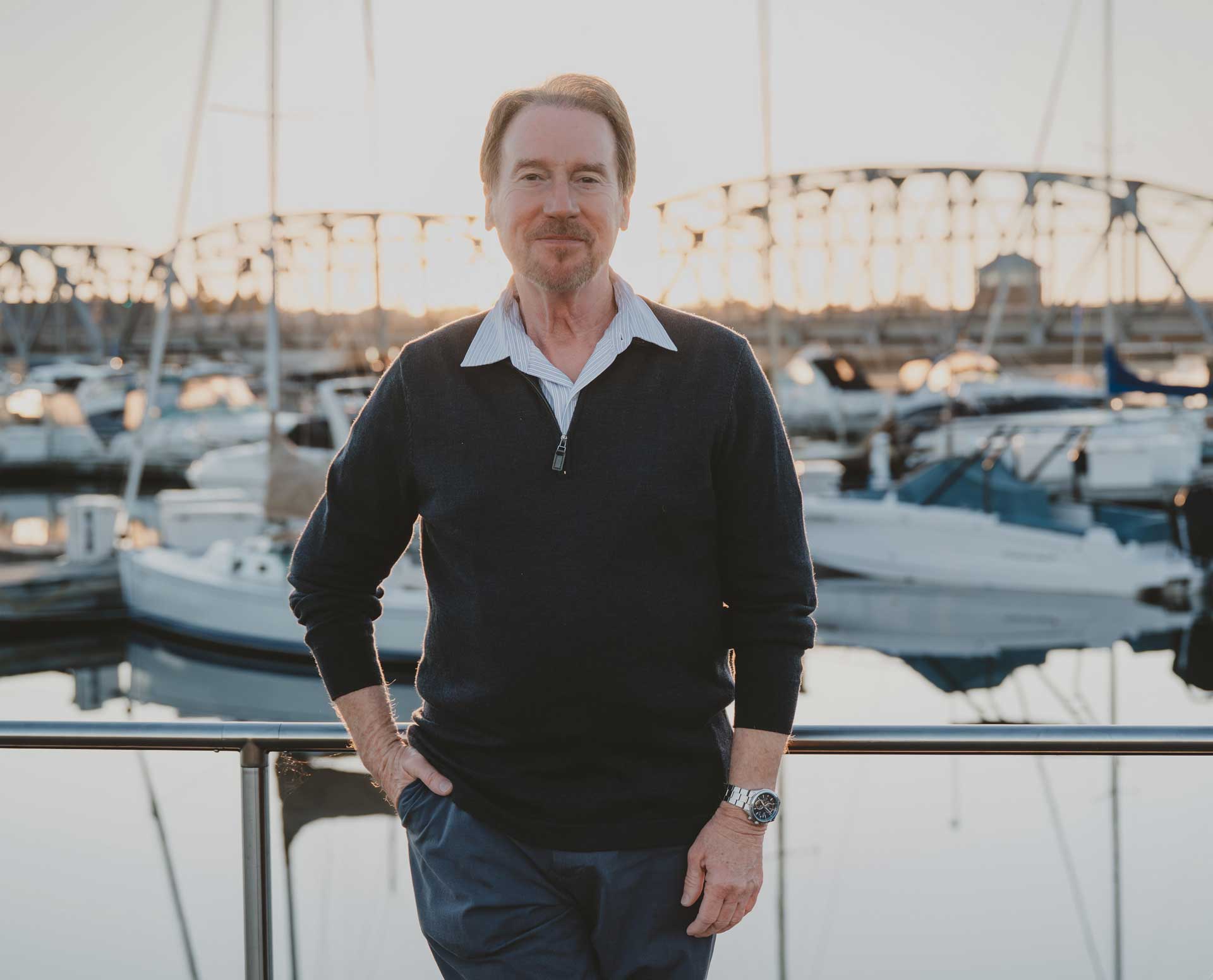 Author C.B. Shutt stands in front of a Steel Bridge